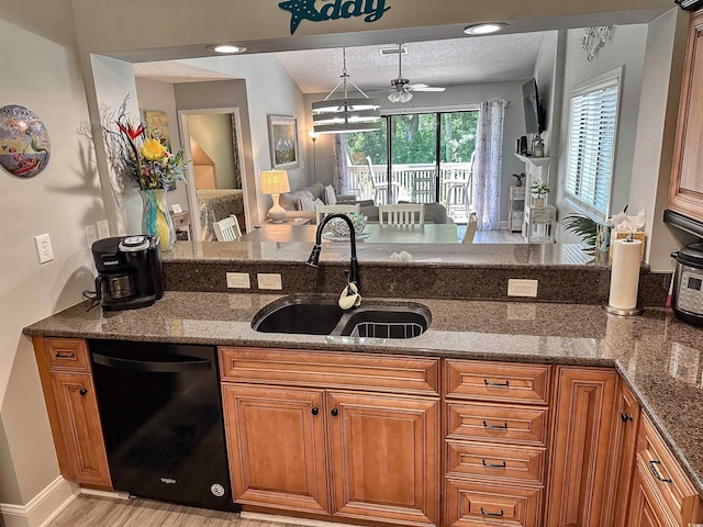 145 Hartland Dr Unit 4-E, Myrtle Beach, SC 29572 - kitchen featuring black dishwasher, brown cabinetry, stone countertops, and a textured ceiling