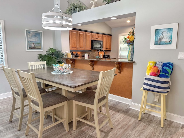 145 Hartland Dr Unit 4-E, Myrtle Beach, SC 29572 - dining room featuring light wood finished floors, lofted ceiling, recessed lighting, and a chandelier