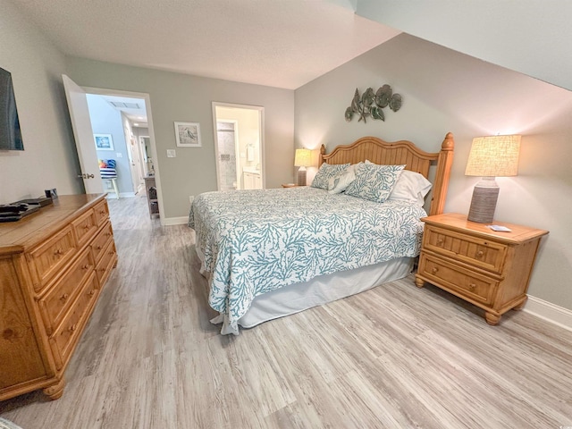 145 Hartland Dr Unit 4-E, Myrtle Beach, SC 29572 - bedroom with light wood finished floors and connected bathroom