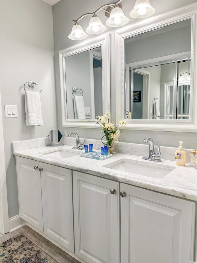 145 Hartland Dr Unit 4-E, Myrtle Beach, SC 29572 - bathroom with double vanity and wood finished floors