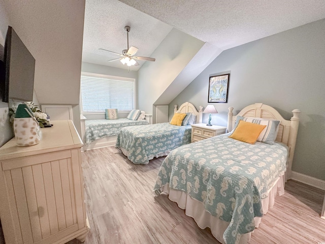 145 Hartland Dr Unit 4-E, Myrtle Beach, SC 29572 - bedroom featuring wood finished floors, a textured ceiling, a ceiling fan, and lofted ceiling