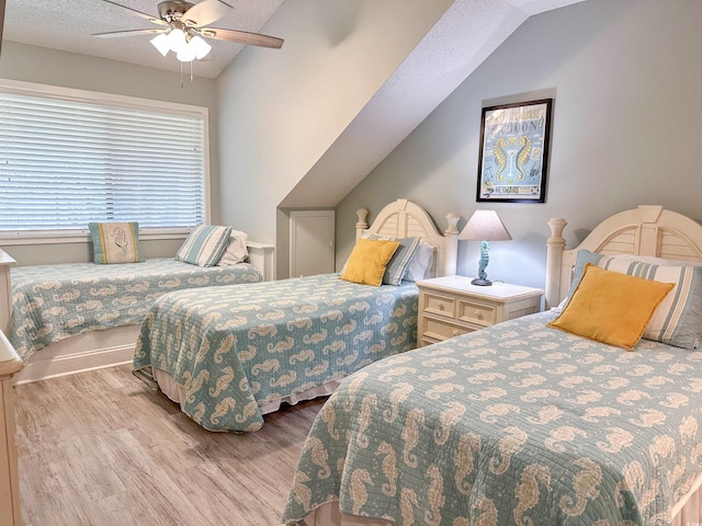 145 Hartland Dr Unit 4-E, Myrtle Beach, SC 29572 - bedroom with lofted ceiling, wood finished floors, ceiling fan, and a textured ceiling