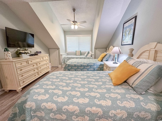 145 Hartland Dr Unit 4-E, Myrtle Beach, SC 29572 - bedroom featuring a textured ceiling, wood finished floors, lofted ceiling, and a ceiling fan