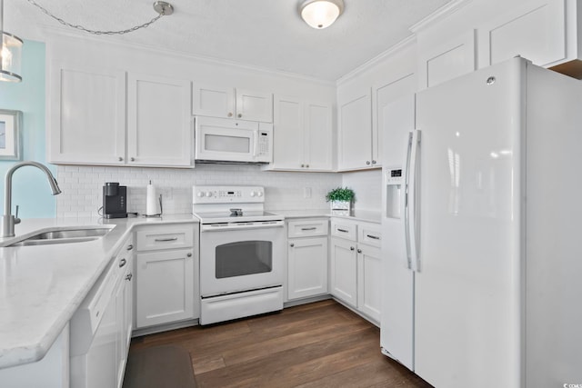 4105 S Ocean Blvd Unit 102, North Myrtle Beach, SC 29582 - kitchen featuring white appliances, crown molding, white cabinetry, backsplash, and dark wood-style floors