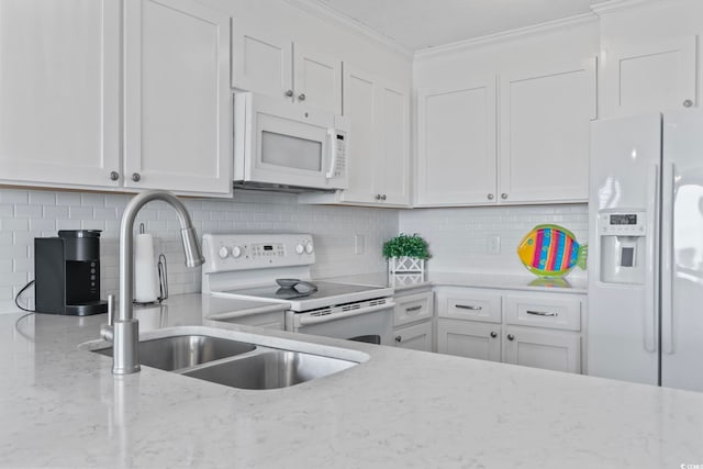 4105 S Ocean Blvd Unit 102, North Myrtle Beach, SC 29582 - kitchen featuring white appliances, ornamental molding, white cabinetry, decorative backsplash, and light stone countertops