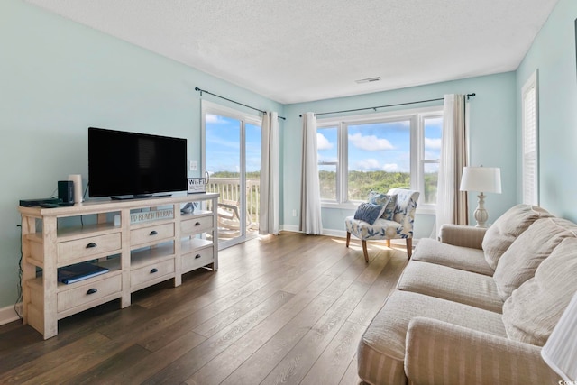 4105 S Ocean Blvd Unit 102, North Myrtle Beach, SC 29582 - living area with dark wood-type flooring and a textured ceiling
