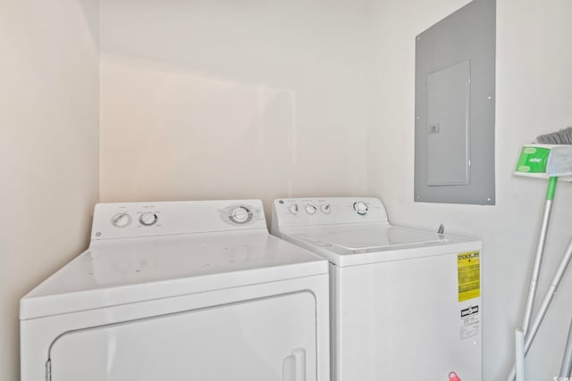 4105 S Ocean Blvd Unit 102, North Myrtle Beach, SC 29582 - laundry room featuring electric panel and independent washer and dryer