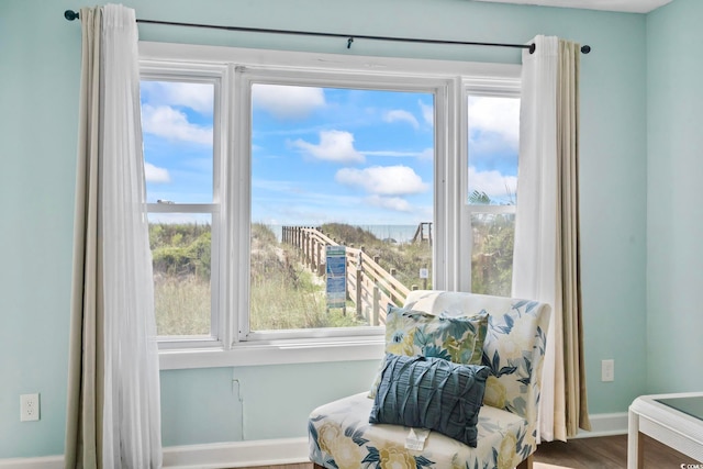 4105 S Ocean Blvd Unit 102, North Myrtle Beach, SC 29582 - living area with wood finished floors and healthy amount of natural light