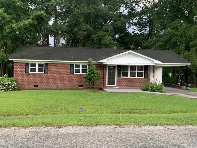 3110 Pinewood Dr, Loris, SC 29569 - ranch-style house featuring crawl space, driveway, a front lawn, a carport, and brick siding