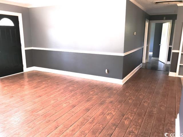 3110 Pinewood Dr, Loris, SC 29569 - foyer featuring hardwood / wood-style floors and ornamental molding