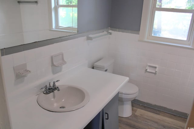 3110 Pinewood Dr, Loris, SC 29569 - bathroom with vanity, tile walls, wood finished floors, and a wainscoted wall