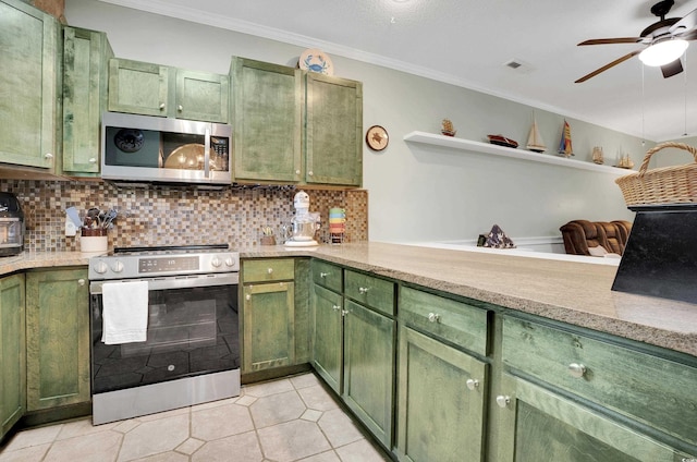 4221 Hibiscus Dr Unit 8-203, Little River, SC 29566 - kitchen with green cabinets, stainless steel appliances, a ceiling fan, and crown molding