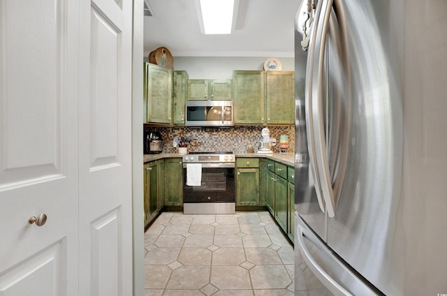 4221 Hibiscus Dr Unit 8-203, Little River, SC 29566 - kitchen featuring appliances with stainless steel finishes, green cabinetry, backsplash, crown molding, and light countertops