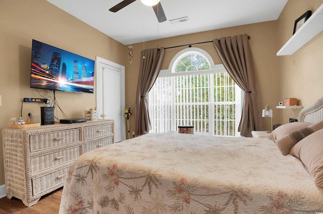 4221 Hibiscus Dr Unit 8-203, Little River, SC 29566 - bedroom featuring wood finished floors and ceiling fan