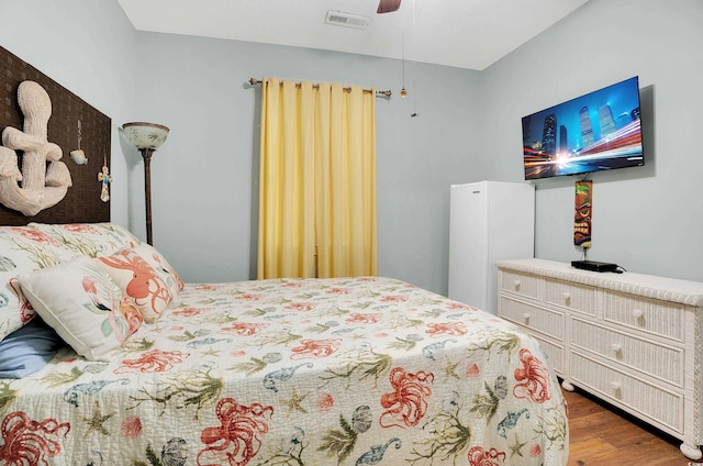 4221 Hibiscus Dr Unit 8-203, Little River, SC 29566 - bedroom featuring wood finished floors and ceiling fan