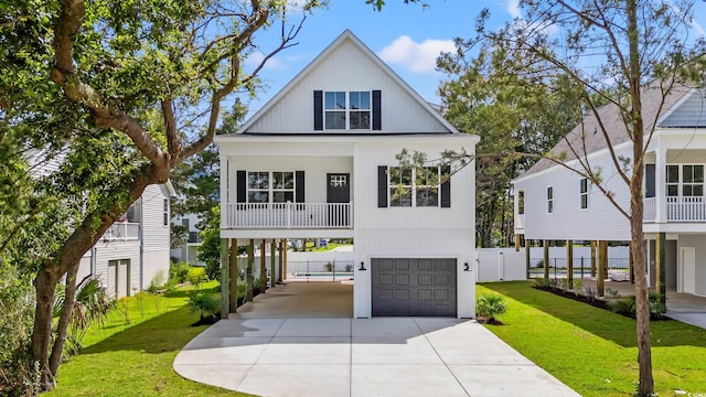 1718 26th Ave N, North Myrtle Beach, SC 29582 - view of front of home featuring driveway and a garage