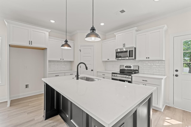 1718 26th Ave N, North Myrtle Beach, SC 29582 - kitchen featuring appliances with stainless steel finishes, white cabinetry, light countertops, recessed lighting, and light wood-style flooring