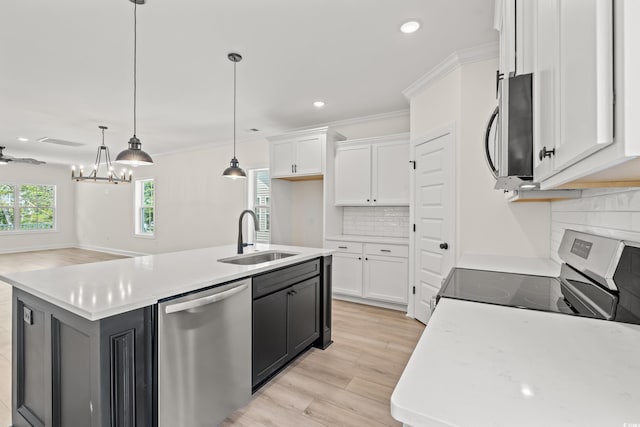 1718 26th Ave N, North Myrtle Beach, SC 29582 - kitchen featuring appliances with stainless steel finishes, white cabinetry, light wood-style flooring, recessed lighting, and light countertops