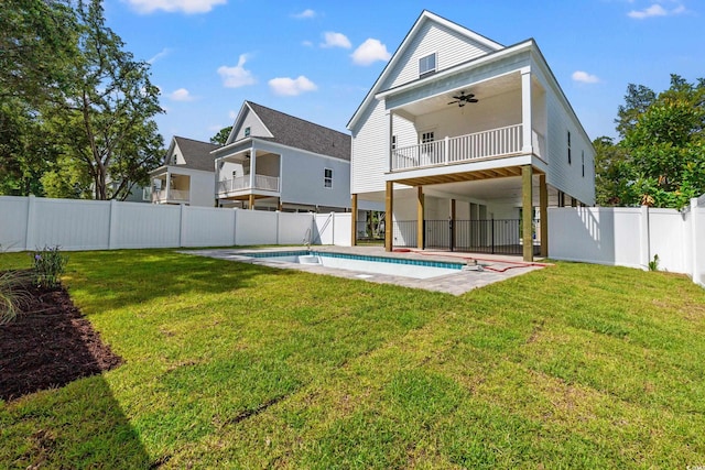 1718 26th Ave N, North Myrtle Beach, SC 29582 - rear view of property featuring a ceiling fan, a balcony, and a fenced backyard