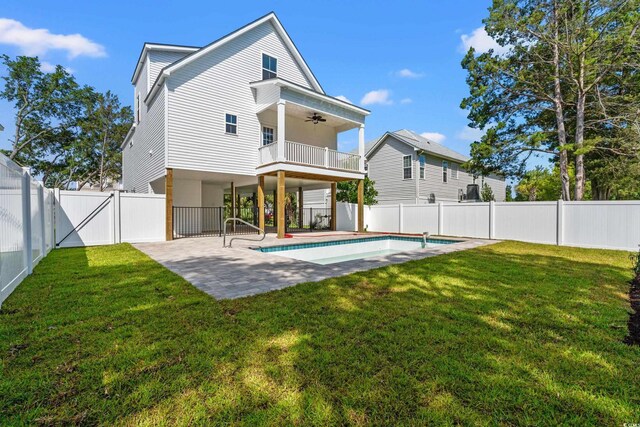 1718 26th Ave N, North Myrtle Beach, SC 29582 - back of property featuring ceiling fan, a fenced backyard, a patio area, a balcony, and a gate