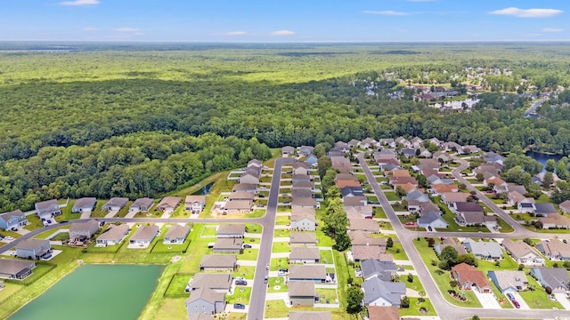 190 Belmonte Dr, Myrtle Beach, SC 29588 - aerial perspective of suburban area featuring a heavily wooded area and a large body of water