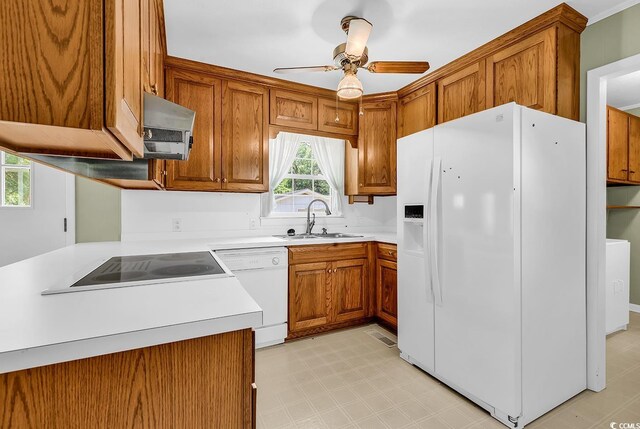 823 Bellamy Ave, Murrells Inlet, SC 29576 - kitchen with white appliances, brown cabinets, ceiling fan, light countertops, and light flooring