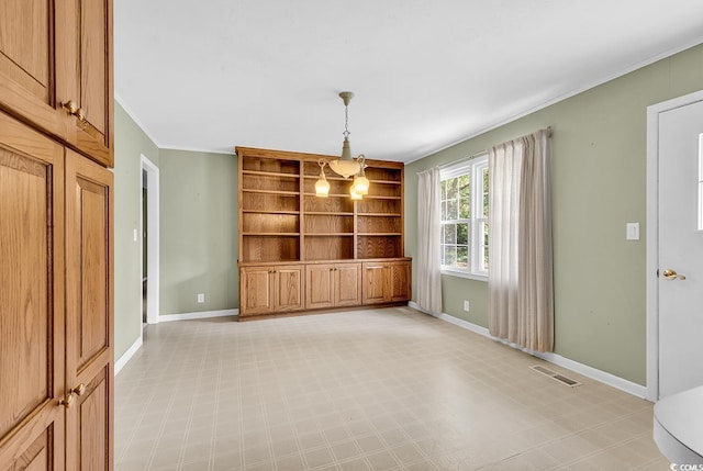 823 Bellamy Ave, Murrells Inlet, SC 29576 - unfurnished dining area featuring crown molding, built in shelves, and light flooring
