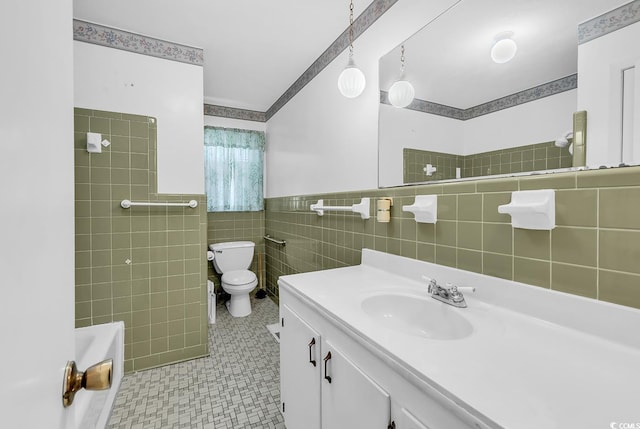 823 Bellamy Ave, Murrells Inlet, SC 29576 - full bath with tile walls, a tub, vanity, a shower, and wainscoting