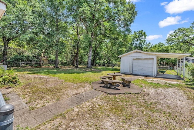 823 Bellamy Ave, Murrells Inlet, SC 29576 - view of yard featuring an outbuilding and a garage