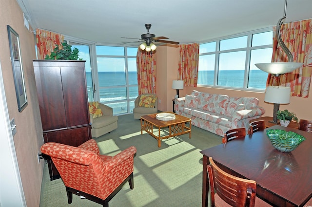 3500 N Ocean Blvd Unit 701-702, North Myrtle Beach, SC 29582 - carpeted living area with a water view, ceiling fan, and healthy amount of natural light