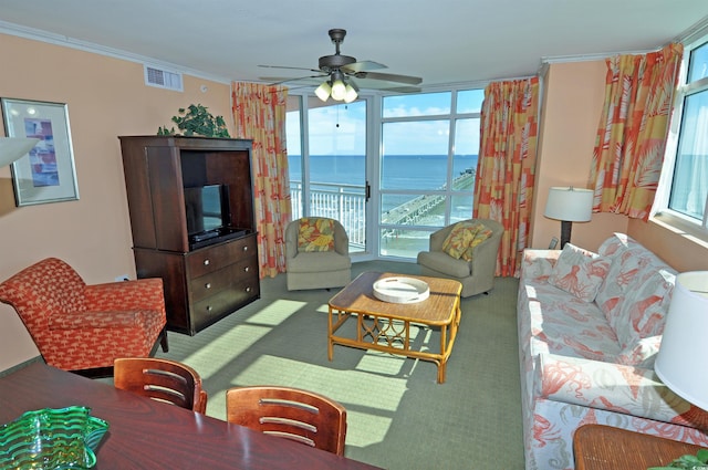 3500 N Ocean Blvd Unit 701-702, North Myrtle Beach, SC 29582 - living area with healthy amount of natural light, ceiling fan, ornamental molding, and carpet