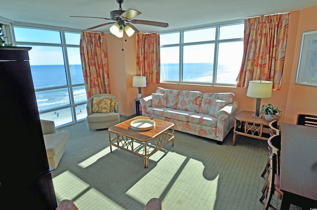 3500 N Ocean Blvd Unit 701-702, North Myrtle Beach, SC 29582 - carpeted living room with a water view and ceiling fan