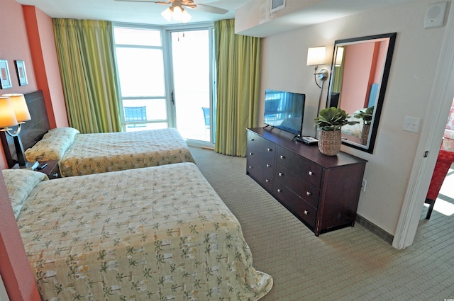 3500 N Ocean Blvd Unit 701-702, North Myrtle Beach, SC 29582 - carpeted bedroom featuring access to exterior and baseboards
