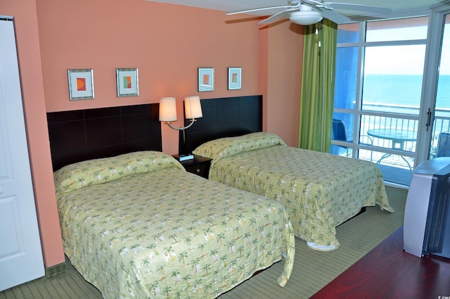 3500 N Ocean Blvd Unit 701-702, North Myrtle Beach, SC 29582 - bedroom with carpet flooring, ceiling fan, a water view, and access to outside
