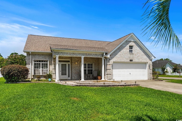 4162 Dupree Dr, Little River, SC 29566 - view of front of house featuring brick siding, concrete driveway, a front yard, and covered porch