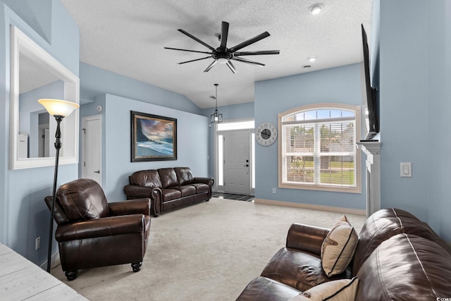 4162 Dupree Dr, Little River, SC 29566 - living area with carpet floors, ceiling fan, lofted ceiling, and a textured ceiling