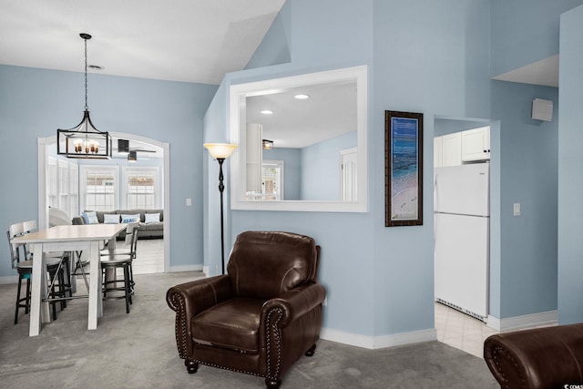4162 Dupree Dr, Little River, SC 29566 - dining area with a chandelier, high vaulted ceiling, and light colored carpet