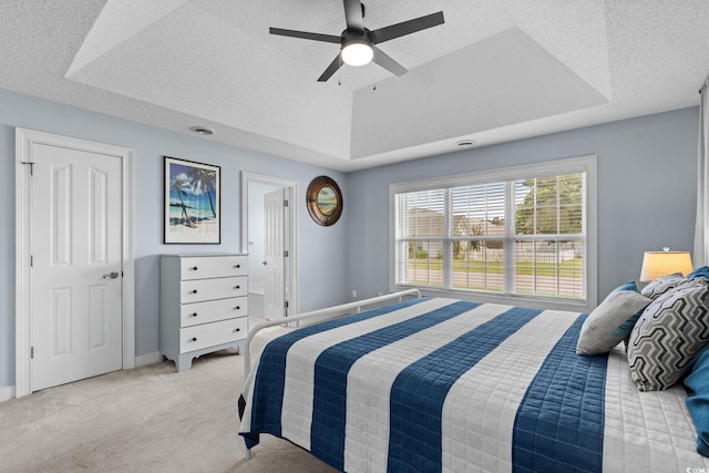 4162 Dupree Dr, Little River, SC 29566 - bedroom featuring carpet flooring, a raised ceiling, a textured ceiling, and a ceiling fan