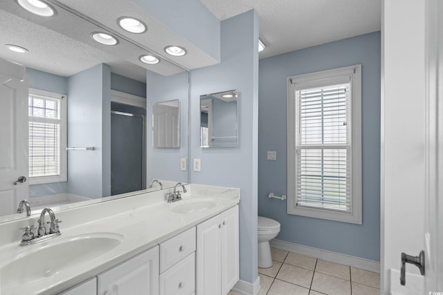 4162 Dupree Dr, Little River, SC 29566 - bathroom featuring a textured ceiling, double vanity, a stall shower, and tile patterned floors