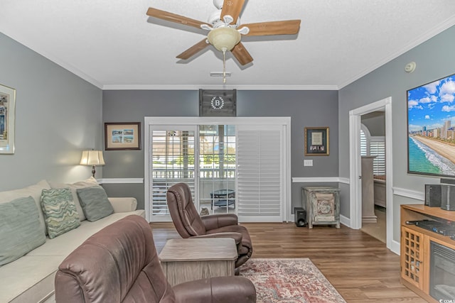 4173 Hibiscus Dr Unit 103, Little River, SC 29566 - living area with a ceiling fan, wood finished floors, and ornamental molding