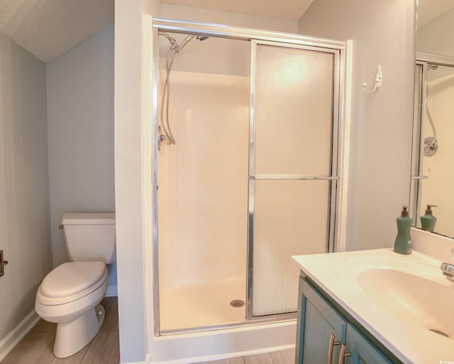 1409 Ashwood Cir, Surfside Beach, SC 29575 - bathroom featuring a stall shower, vanity, and wood finished floors