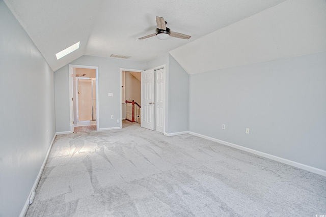 1409 Ashwood Cir, Surfside Beach, SC 29575 - bonus room featuring lofted ceiling, a ceiling fan, carpet, and a skylight