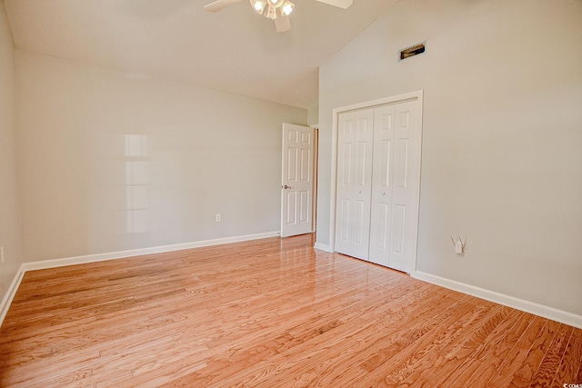 1409 Ashwood Cir, Surfside Beach, SC 29575 - unfurnished bedroom featuring light wood-style floors, a closet, ceiling fan, and high vaulted ceiling