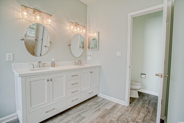 1409 Ashwood Cir, Surfside Beach, SC 29575 - bathroom featuring wood finished floors and double vanity