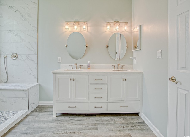 1409 Ashwood Cir, Surfside Beach, SC 29575 - full bathroom featuring double vanity, wood finished floors, and tiled shower