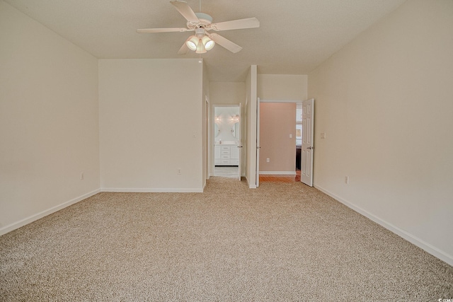 1409 Ashwood Cir, Surfside Beach, SC 29575 - empty room featuring light colored carpet and a ceiling fan