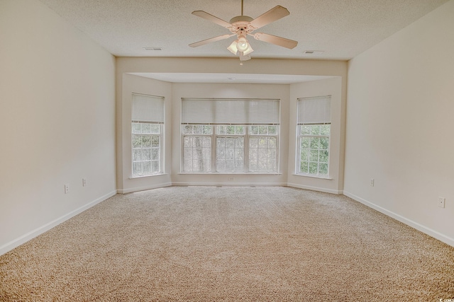 1409 Ashwood Cir, Surfside Beach, SC 29575 - empty room with carpet floors, ceiling fan, and a textured ceiling