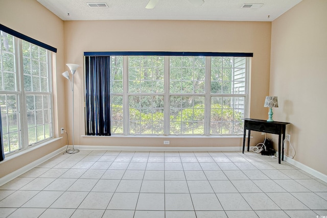 1409 Ashwood Cir, Surfside Beach, SC 29575 - spare room with light tile patterned floors and a textured ceiling