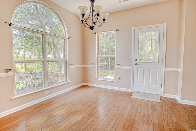 1409 Ashwood Cir, Surfside Beach, SC 29575 - foyer entrance with a chandelier and light wood finished floors