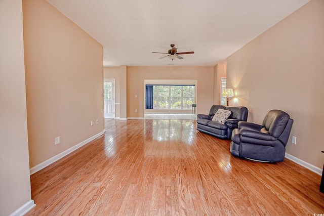 1409 Ashwood Cir, Surfside Beach, SC 29575 - unfurnished living room featuring light wood-type flooring and a ceiling fan